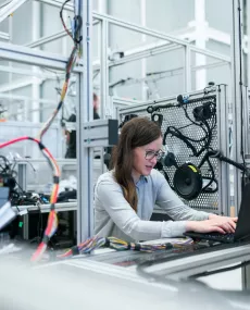 Female scientist at a computer in a lab